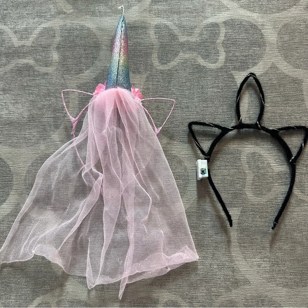 2 Unicorn hairbands. 1 with a veil the other lights up